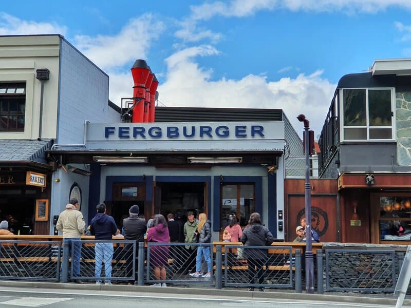 people waiting outside fergburger in queenstown