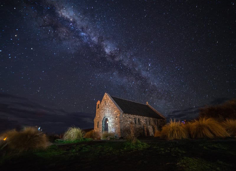 lake tekapo at nighttime with the cottage