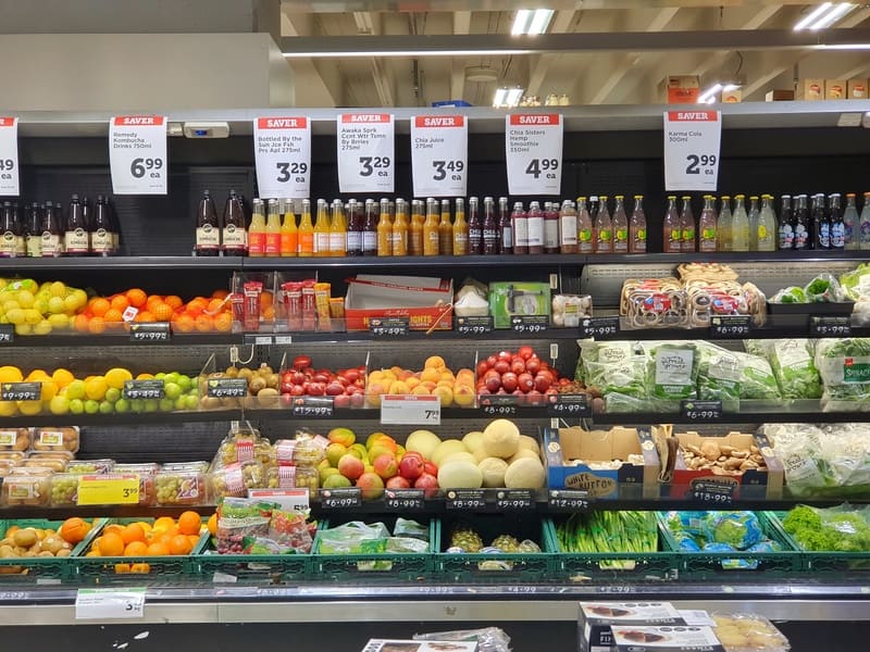 photo of shelves full of fresh fruit and vegetables inside a new world supermarket
