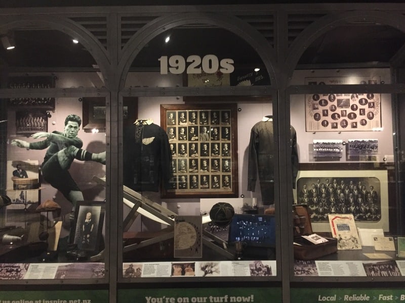 a display case in the new zealand rugby museum featuring artifacts and stories from the 1920's