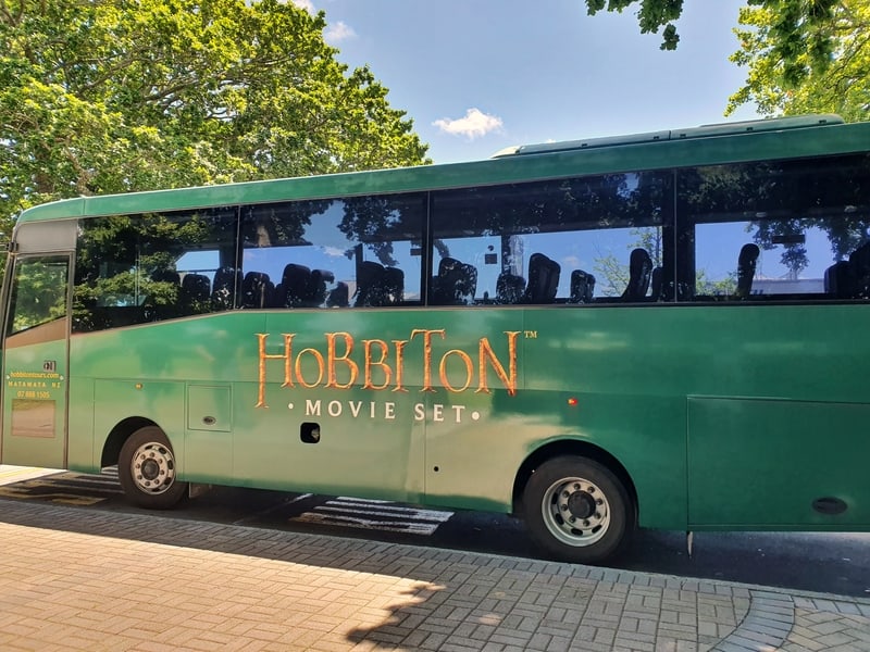 green hobbiton branded bus