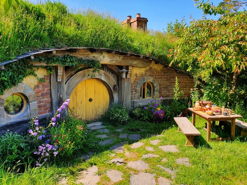 yellow hobbiton door of a hobbit house