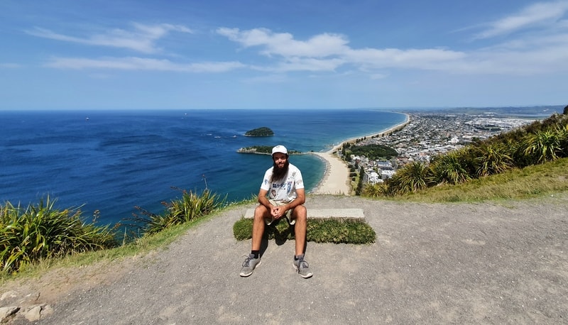 sitting near the summit of the mount in mount maunganui overlooking the ocean