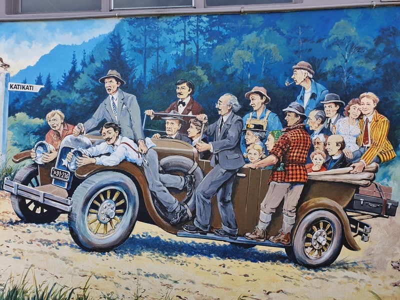 picture of lots of people in a car with the mural called overloaded