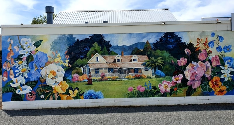 flowers and house on a mural