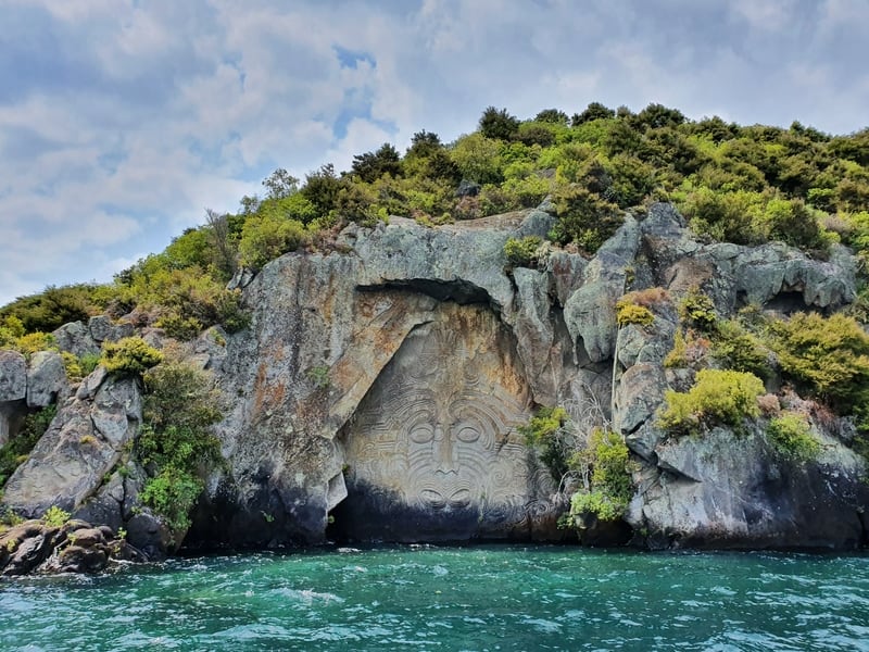 view of maori rock carvings on lake taupo