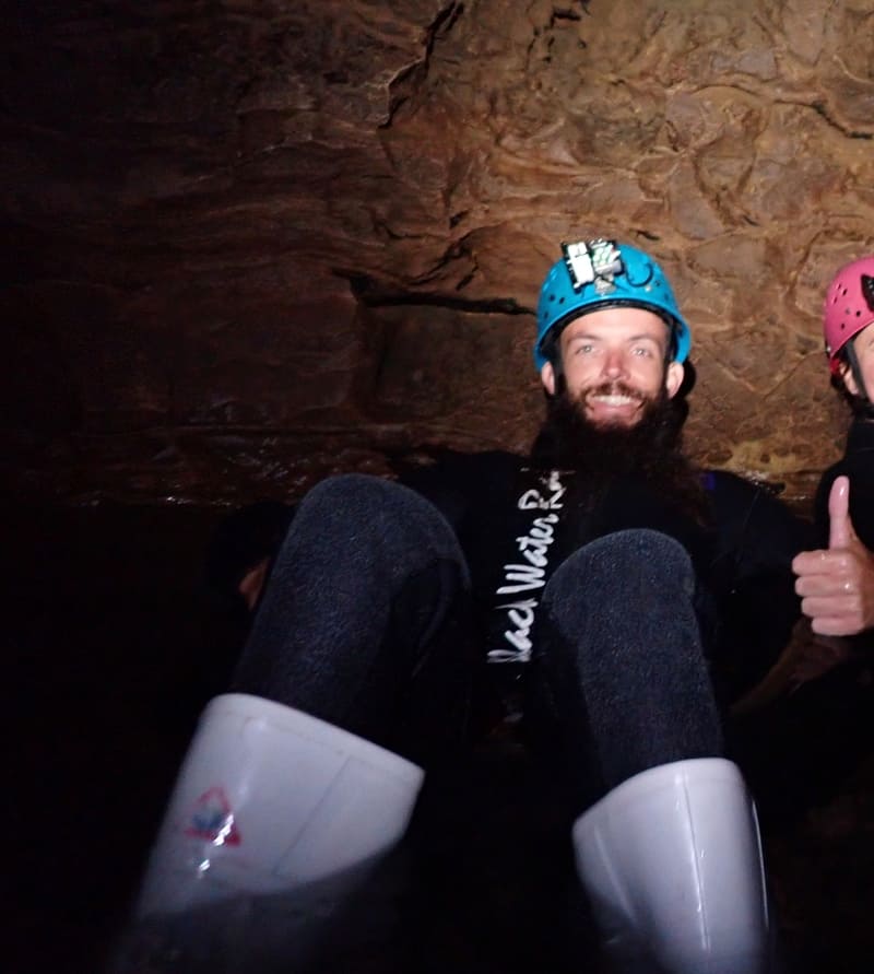 inside the waitomo caves with the thumbs up