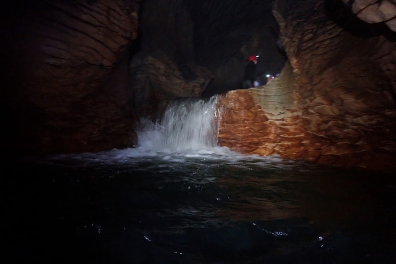 small waterfall inside a cave