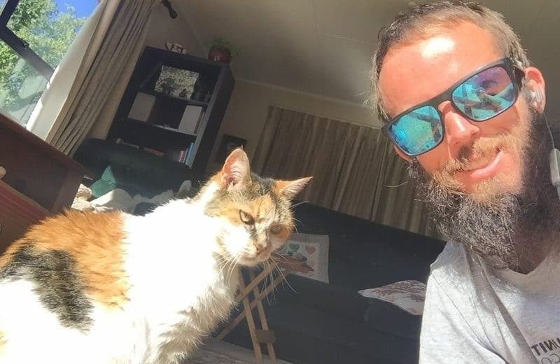 man and cat smiling