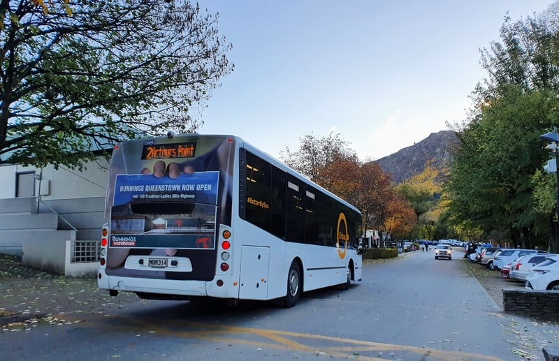 a photo of a queenstown bus for the post about how to get around queenstown