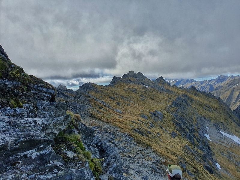 hiking towards the ridgeline for access to mt shrimpton